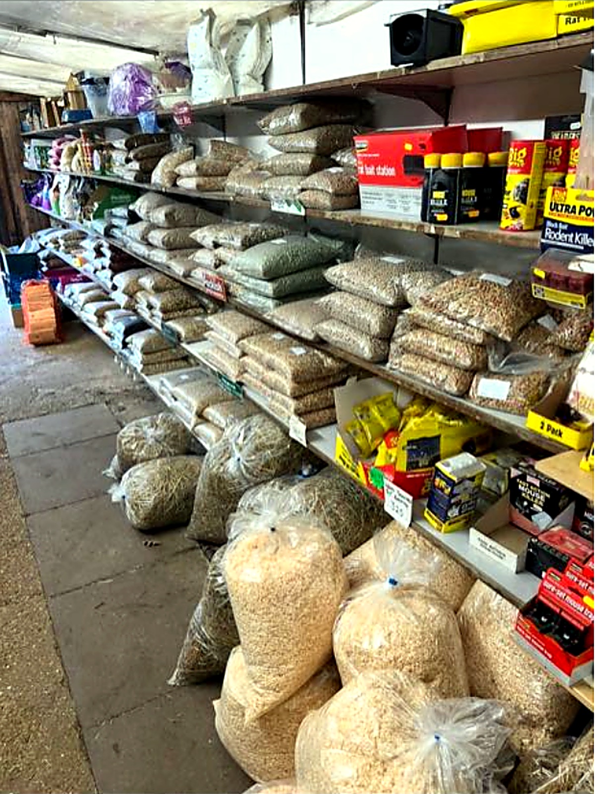 Shelves of bird seed and pet feed in the feed store