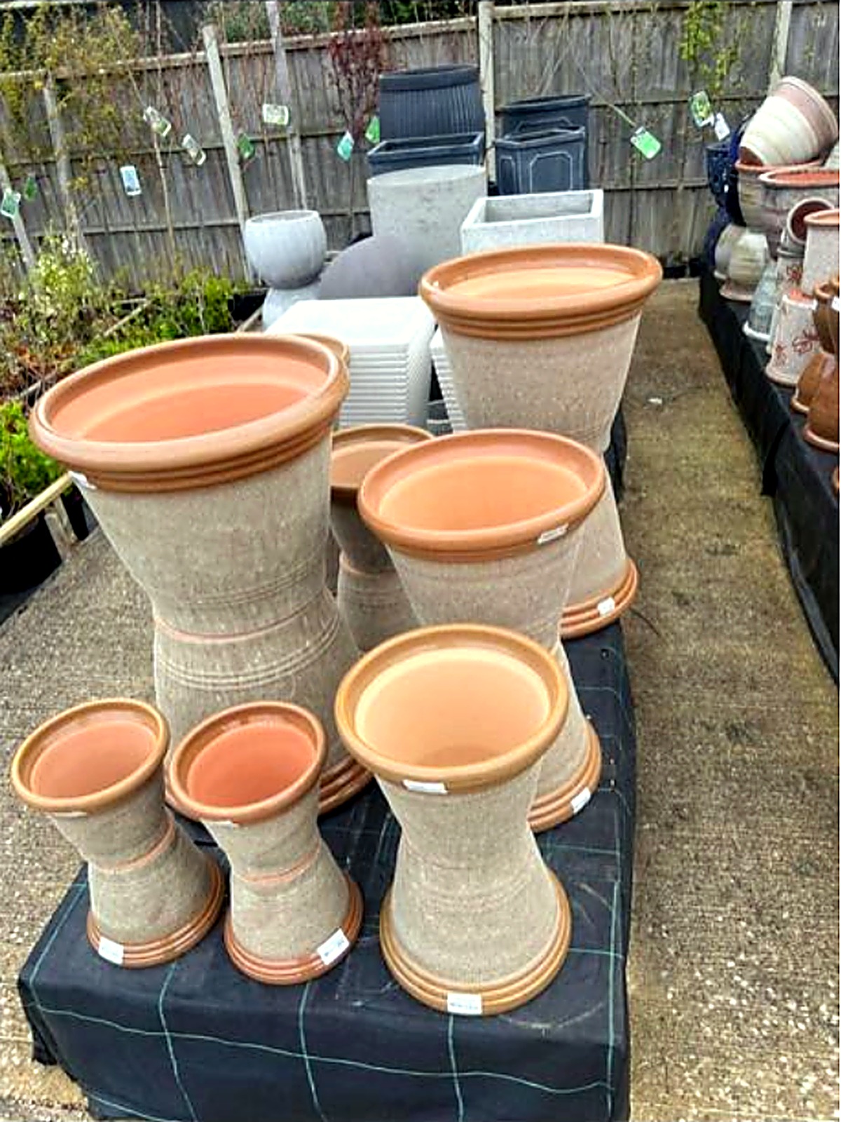 Textured stone-effect planters in several sizes on the display table