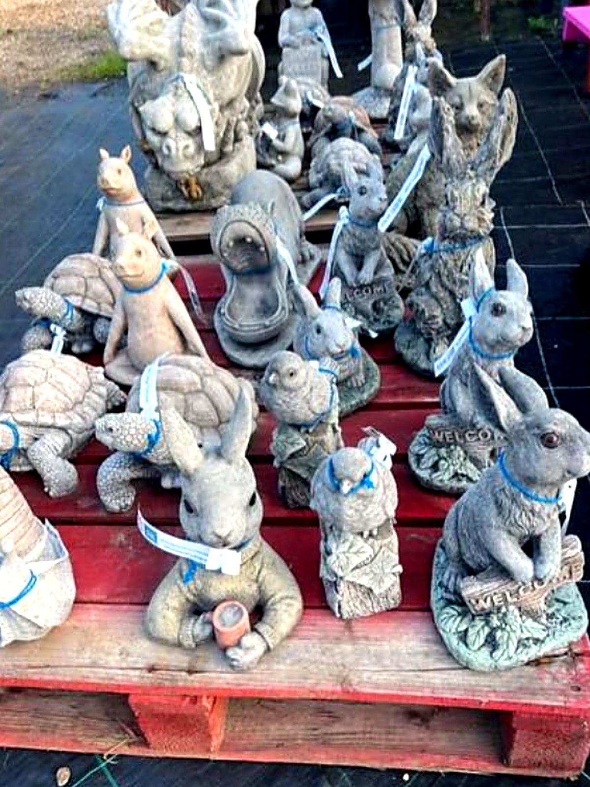 Stone garden animal ornaments including rabbits, tortoises and a fox